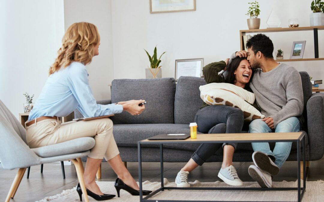 Smile, its free therapy. Shot of a happy couple at a therapy session.